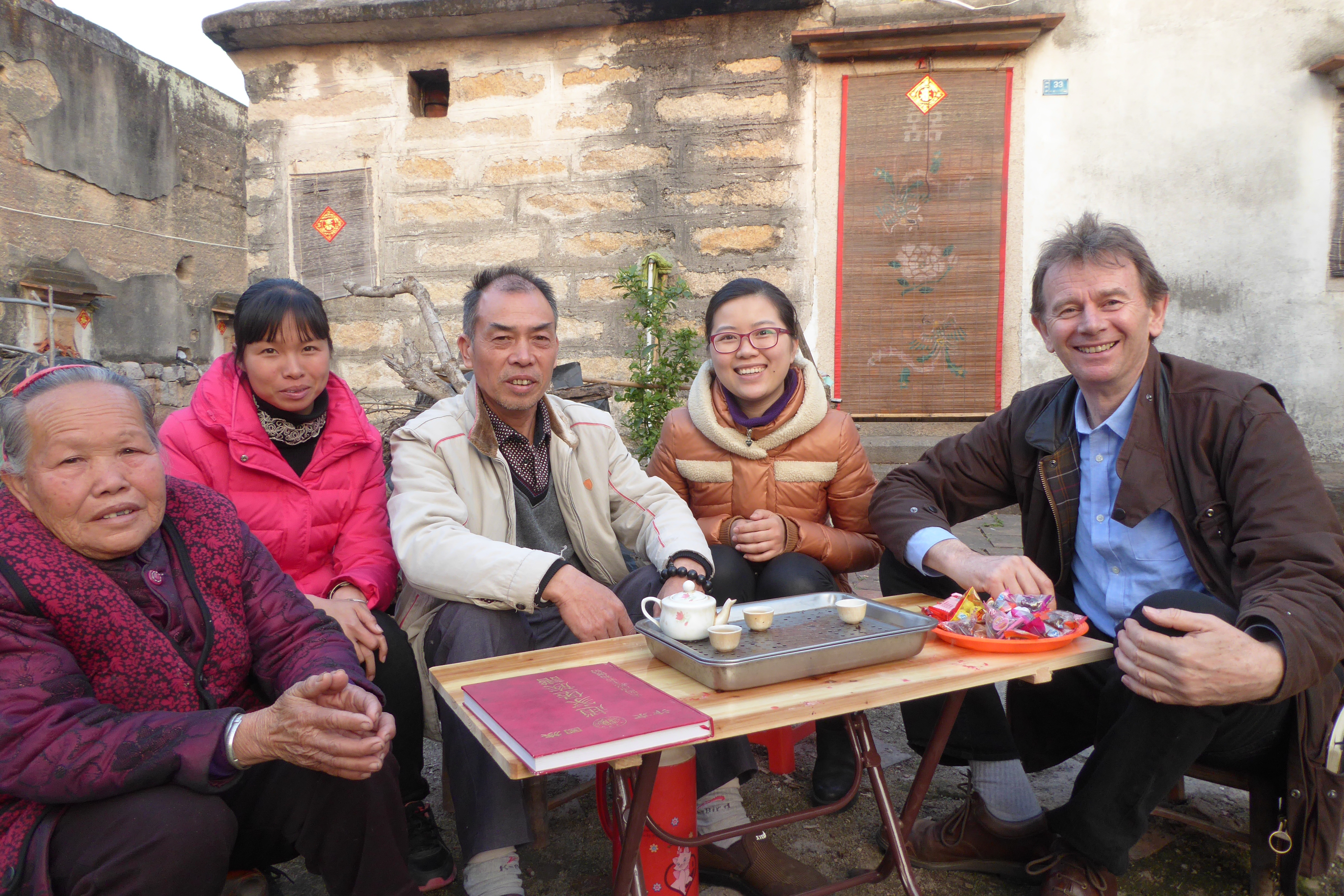 Michael Wood with Zhao family members at their fortified village, Fujian province
